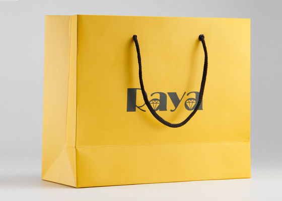 Maniglia di nylon dei sacchetti della spesa di carta opachi gialli e logo su misura stampati